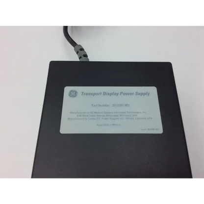 Black rectangular ge transport display power supply 2012183-003 with gray power cord and white label for transport display power