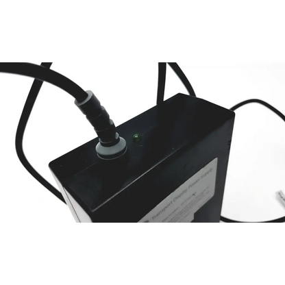 Black rectangular display power supply unit ge transport display power 2012183-004 with green indicator light and connected cables