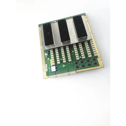Green circuit board with three black components mounted on silver metal plate in ge ultrasound p3rly assembly probe connect