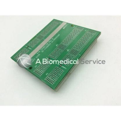 Green rectangular vingmed ultrasound board fb200158-02 xdbus-2 with silver traces and white spherical component on corner