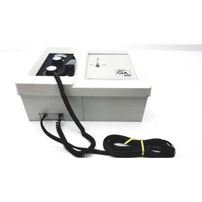 Gray rectangular wall mount dental xray device with black control knobs and coiled cable labeled gx 900 on front panel