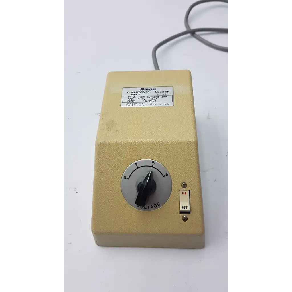 Beige genuine nikon transformer xn made in japan with voltage dial and toggle switch for precise power control