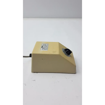 Beige rectangular genuine nikon transformer xn with black rotary knob and gray power cord made in japan
