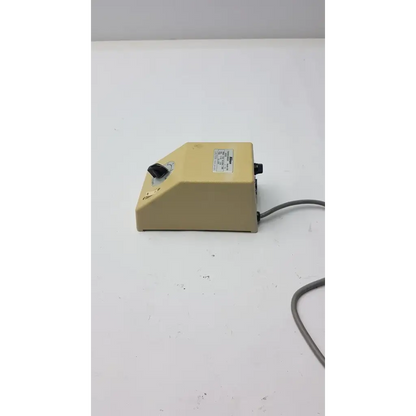 Beige plastic laboratory mixer with black rotary knob and power cord for genuine Nikon transformer xn made in Japan