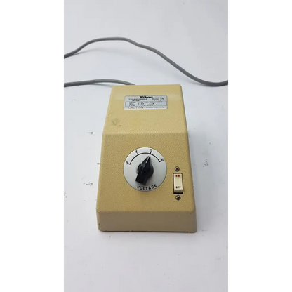 Beige genuine Nikon transformer xn made in Japan with black voltage dial and red-on-white toggle switch