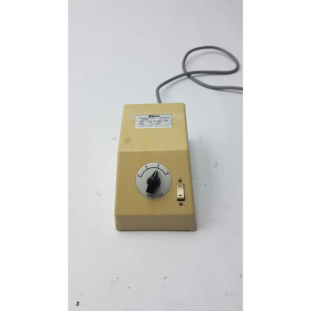 Beige genuine nikon transformer xn made in japan with voltage dial and toggle switch for reliable power conversion