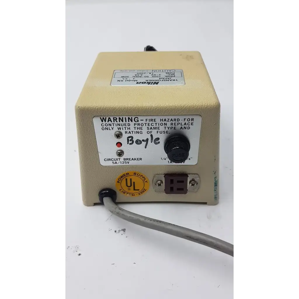 Beige genuine nikon transformer xn power supply unit with black rotary knob and warning label transformer xn made in Japan