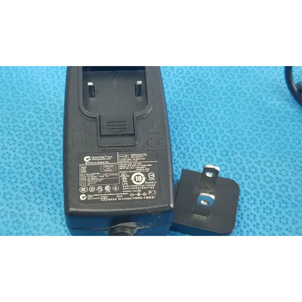 Black plastic gt-41052-1509 adapter charger power adapter back side with detachable uk-style plug and regulatory markings