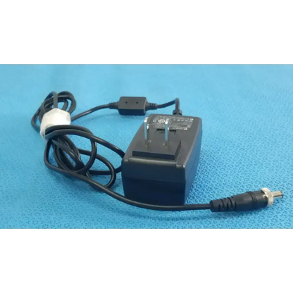 Black plastic gt-41052-1509 adapter charger with coiled power cord and metallic barrel connector power adapter