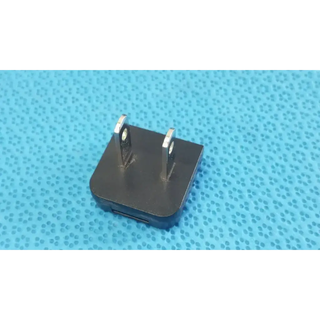 Black rectangular globtek gt-41052-1509 adapter charger with two metal prongs and usb port power adapter side view