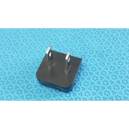 Black rectangular globtek gt-41052-1509 adapter charger with two metal prongs and usb port power adapter side view