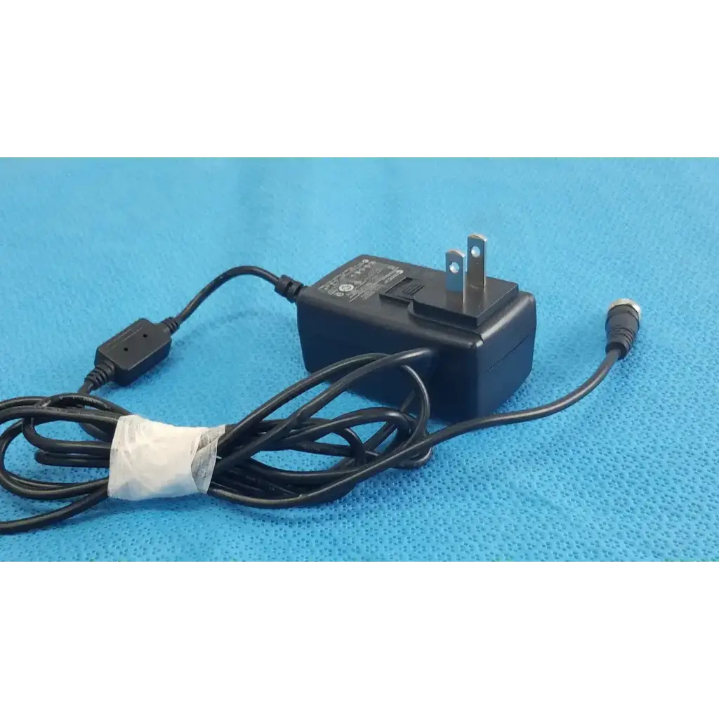 Black plastic globtek gt-41052-1509 adapter charger with coiled power cord and metallic plug power adapter