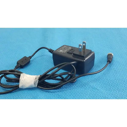 Black plastic globtek gt-41052-1509 adapter charger with coiled power cord and metallic plug power adapter