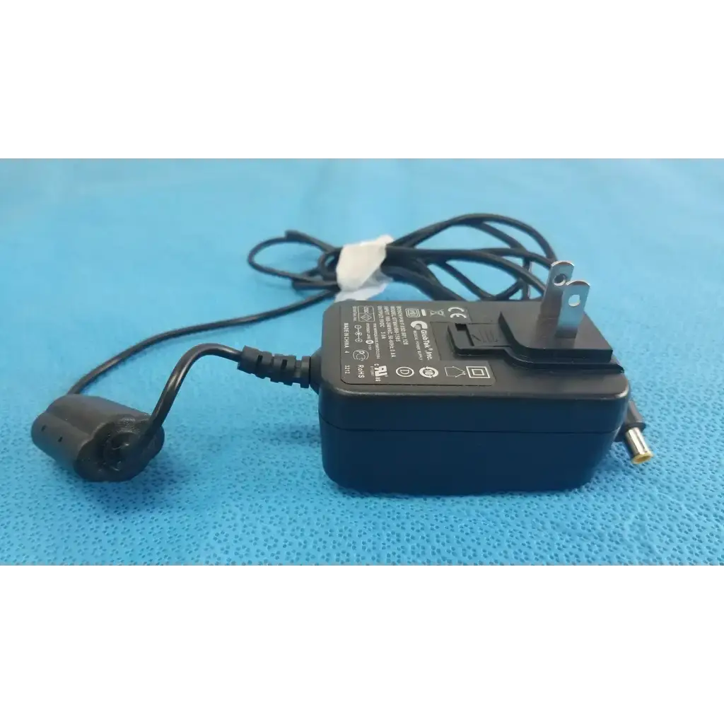 Black plastic globtek gtm41060-1505 medical power supply with coiled power cord and two-prong plug for medical power