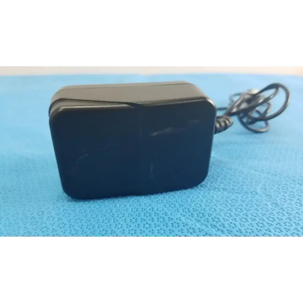 Black plastic Globtek GTM41060-1505 medical power supply with coiled cable for medical power applications