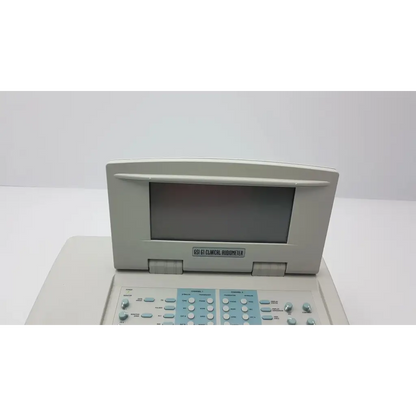 Beige stadler gsi 61 clinical audiometer 1761-97xx with rectangular screen and light blue control panel with buttons