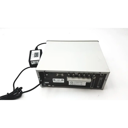 Silver and black grass 15lt physiodata amplifier system with multiple ports and connected power supply at the back side
