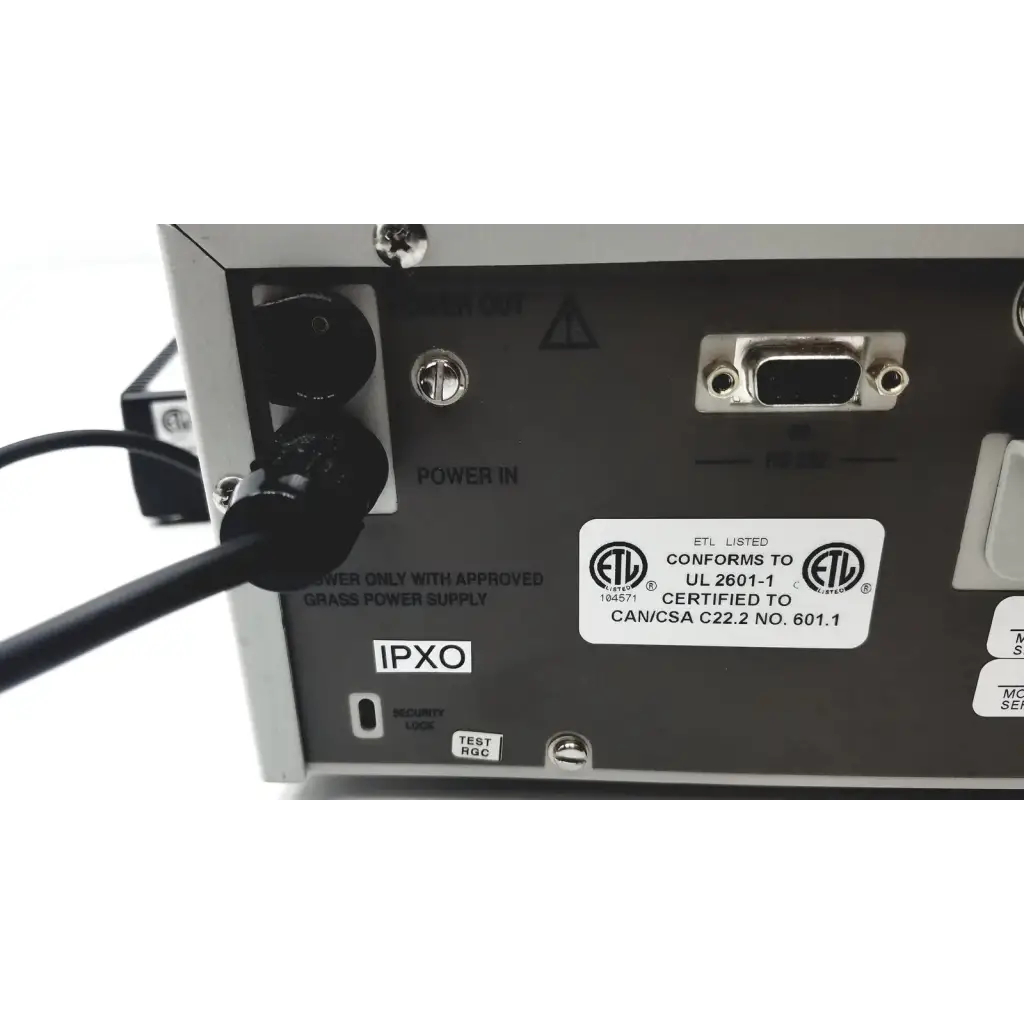 Back side of silver metallic grass 15lt physiodata amplifier system with black power input and db9 serial port labels