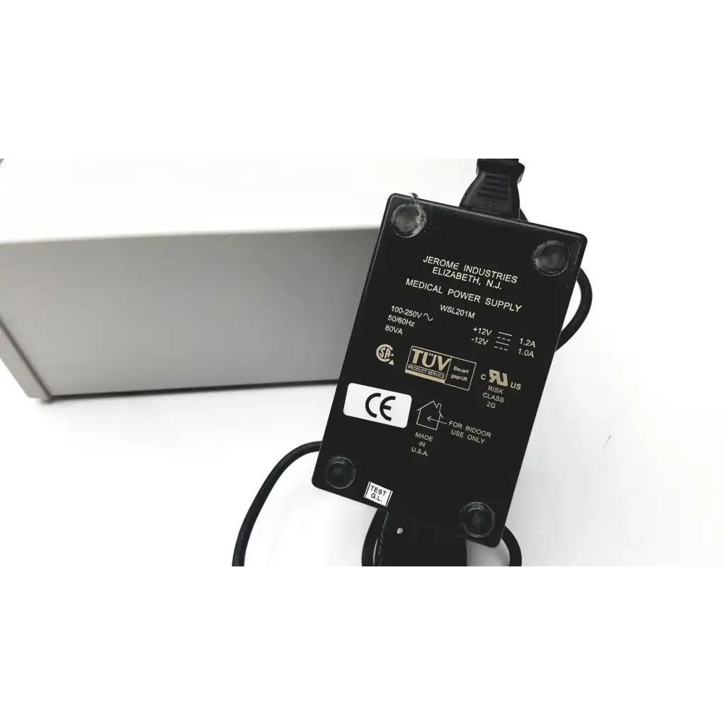 Black rectangular medical power supply adapter with specifications labels on the back for grass 15lt physiodata amplifier system