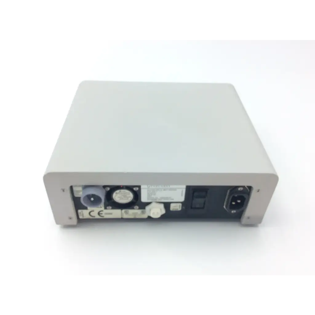 Gray rectangular gynecare md010 motor drive unit rear panel with various ports and connectors 115-230 v