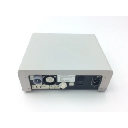 Gray rectangular gynecare md010 motor drive unit rear panel with various ports and connectors 115-230 v