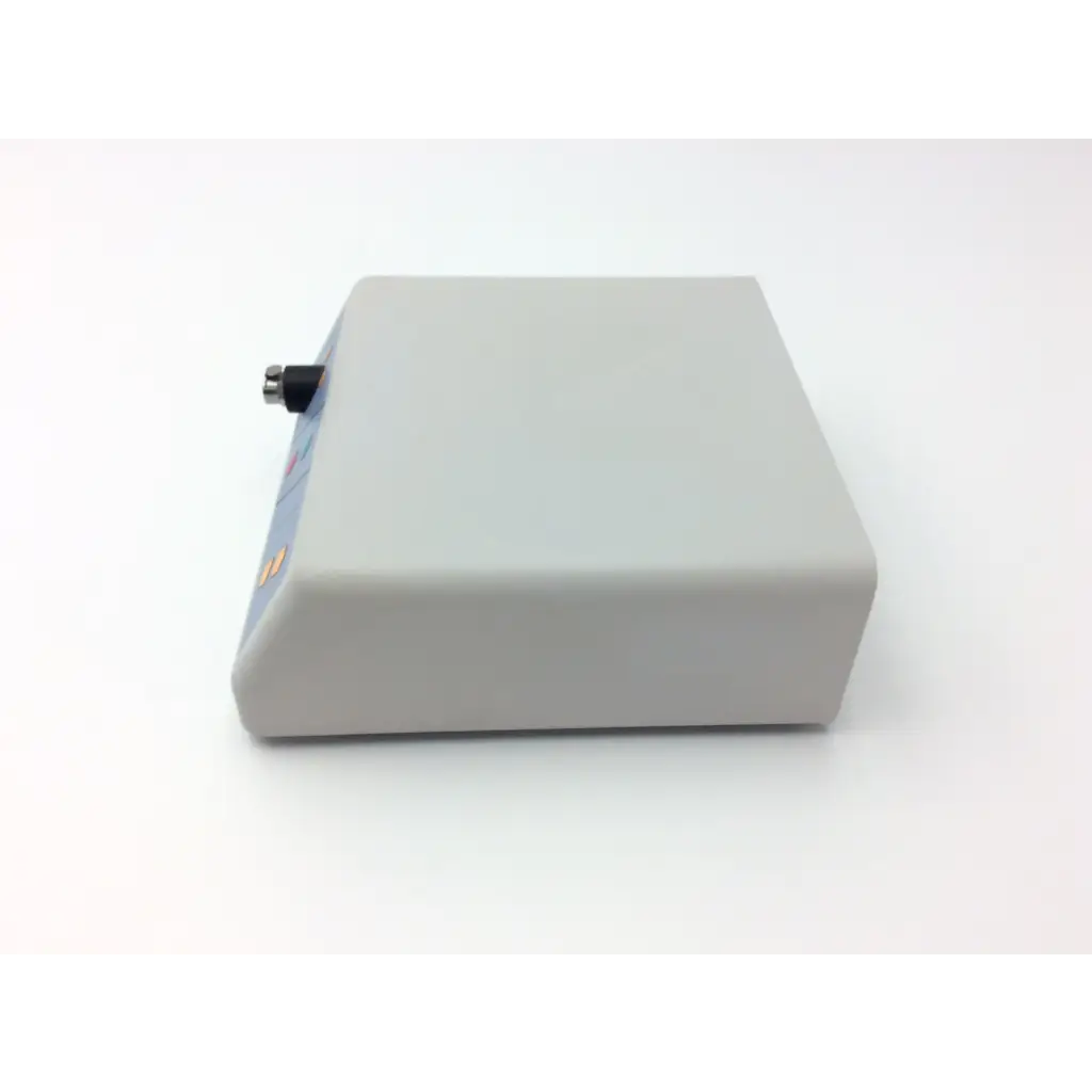 Gray rectangular gynecare md010 motor drive unit with black and silver connector on its side for medical use