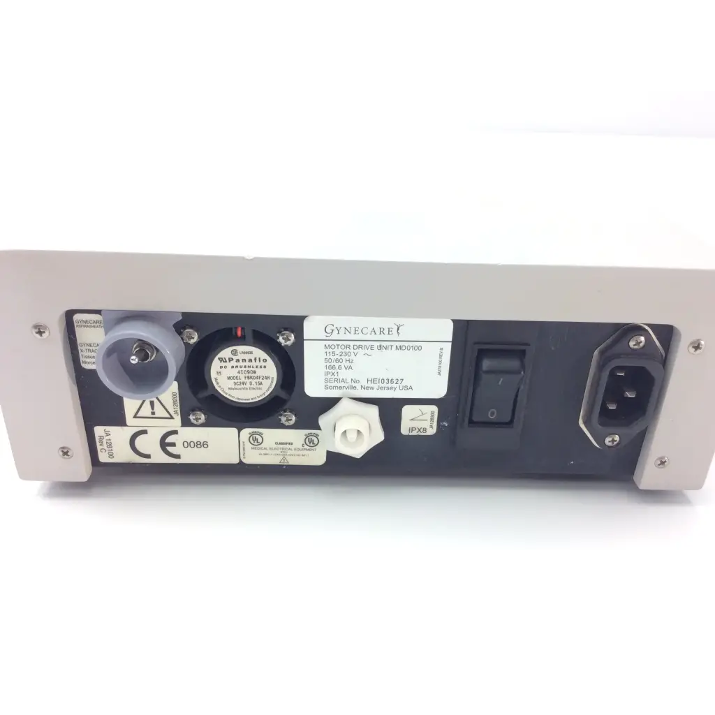 Gray metal gynecare md010 motor drive unit back side with black panel, power switch, ports, and certification labels