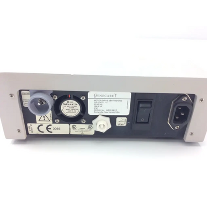 Gray metal gynecare md010 motor drive unit back side with black panel, power switch, ports, and certification labels