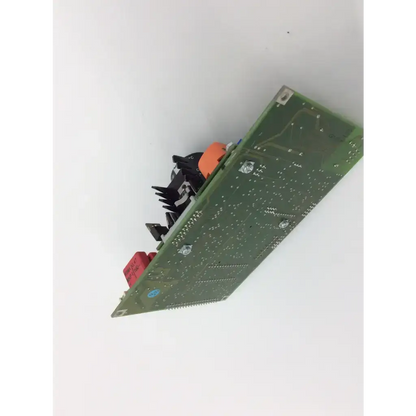 Green printed circuit board with black and orange components mounted on haag streit ophthalmometer 900 4 1149 3300 board