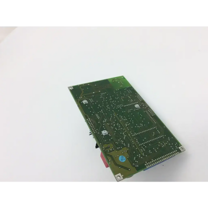 Green rectangular circuit board with silver solder points and metallic components for haag streit ophthalmometer 900