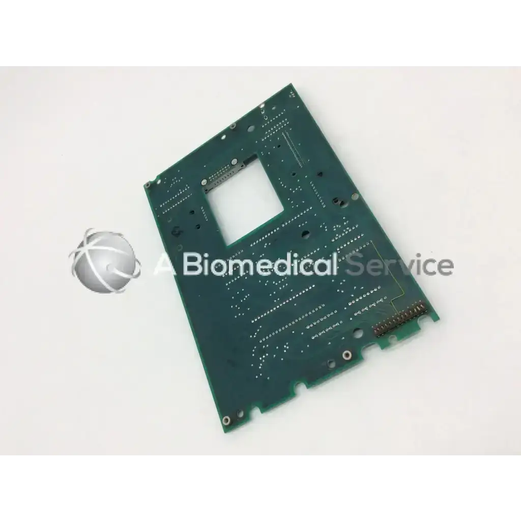 Green rectangular circuit board with central cutout and solder points for haemonetics assy c35396 sch c35397 board