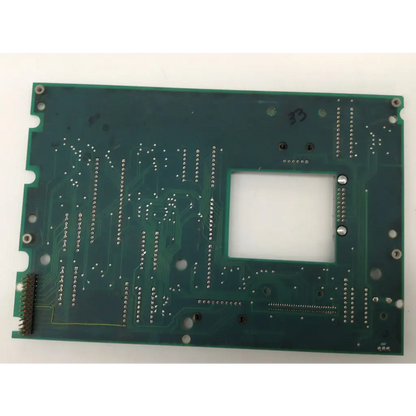 Green rectangular circuit board with central cutout and silver solder points for haemonetics c35396 sch c35397 cs5 control board