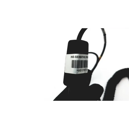 Black cylindrical hand held ws137872 scanteam barcode scanner with white label and barcode on the back side