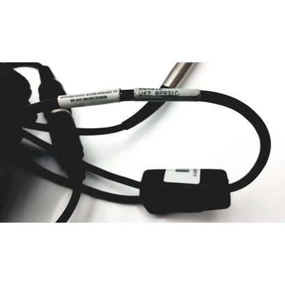 Black cable with small rectangular connector and white label tape for hand held ws137872 scanteam barcode scanner