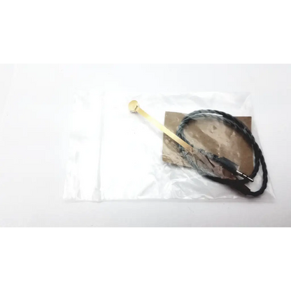 Gold-colored metal hearing aid programming aid programming adapter cable with black braided cord and 3.5mm audio jack