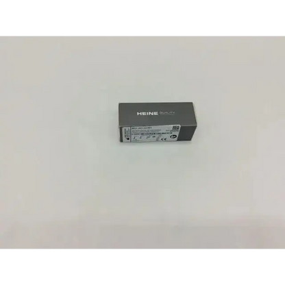 Gray rectangular box with heine quality branding and technical label for heine f-001.22.861 fiber optic laryngoscope handle insert