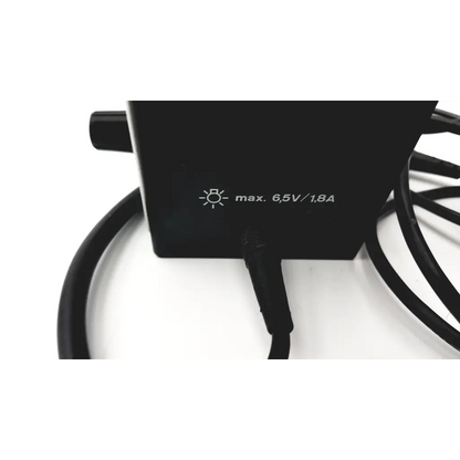 Black rectangular heine omega ophthalmic wired battery supply with coiled cable and max text for ophthalmoscope wired battery