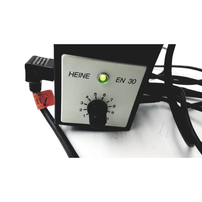 Black heine en 30 control panel with white faceplate, green indicator light, and numbered dial for ophthalmoscope wired battery supply