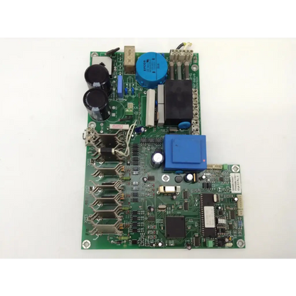 Green main pcb board by heraeus sepatech featuring black and blue capacitors and a central microchip mounted on surface