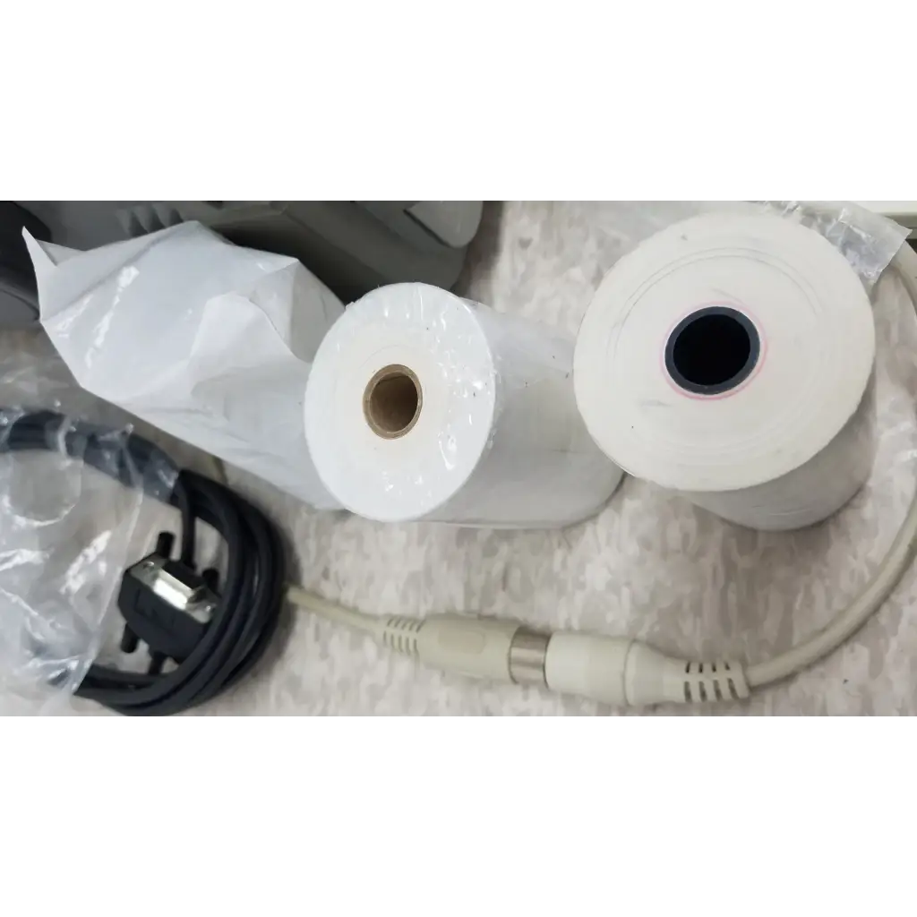 Two white thermal paper rolls for printer included with hewlett packard 8147 optical time domain reflectometer case