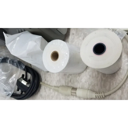 Two white thermal paper rolls for printer included with hewlett packard 8147 optical time domain reflectometer case