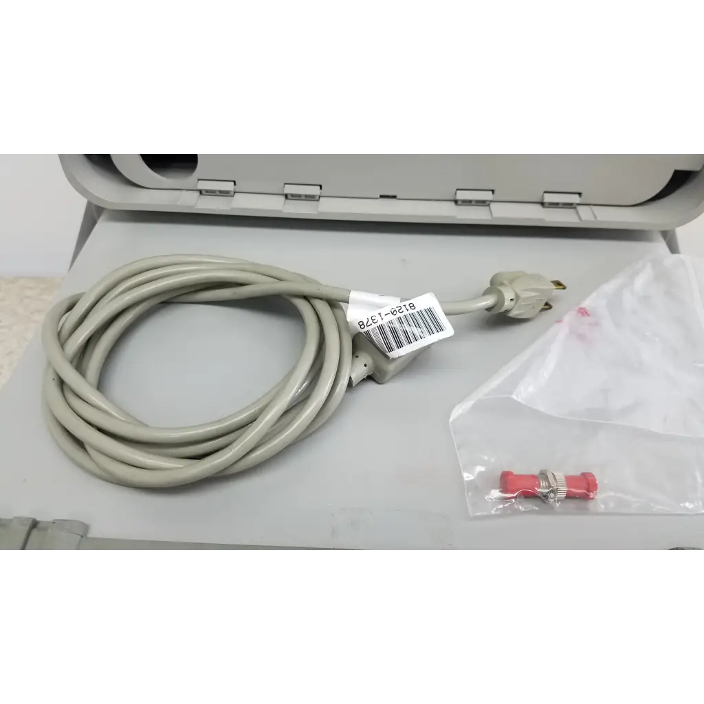 Coiled beige power cord with three-prong plug and barcode for hewlett packard 8147 optical time domain reflectometer accessories
