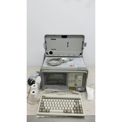 Hewlett Packard 8147 optical time domain reflectometer in gray rugged design with hinged lid and control panel