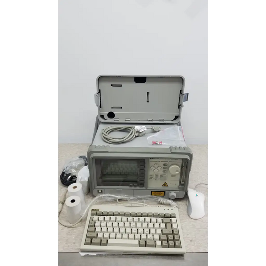 Hewlett Packard 8147 optical time domain reflectometer in gray rugged design with hinged lid and control panel