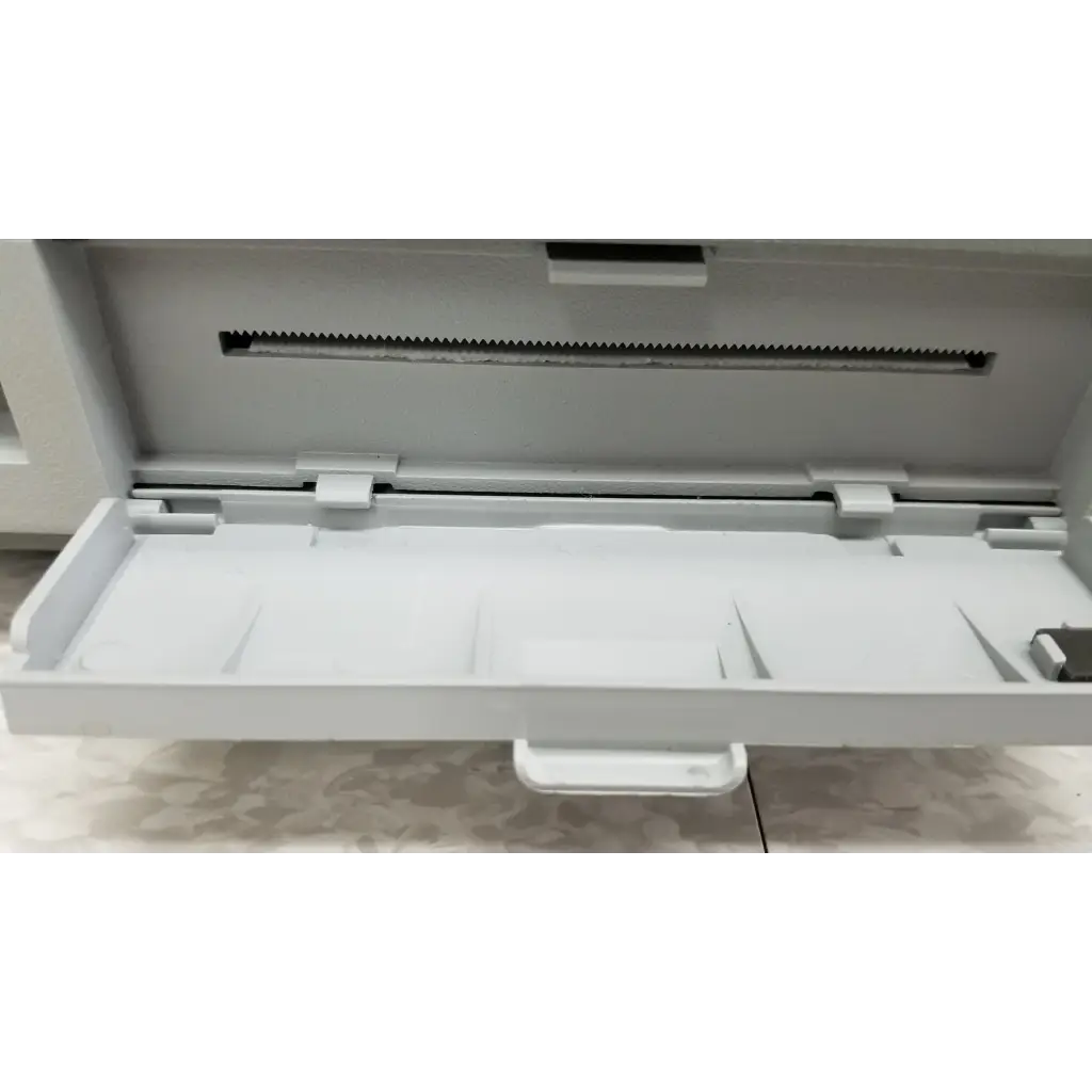 White plastic food storage container with sliding lid and compartments for hewlett packard 8147 optical time domain reflectometer accessories