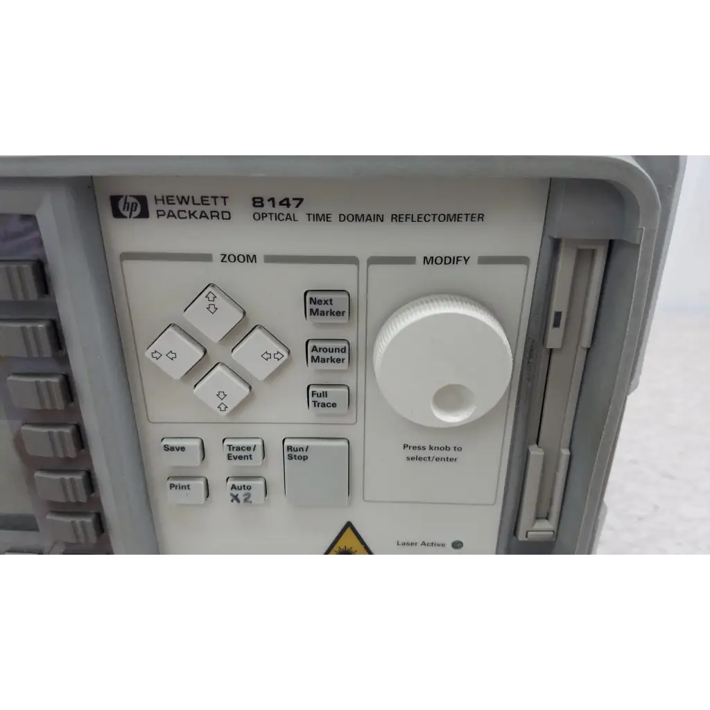 Gray hewlett packard 8147 optical time domain reflectometer with white control panel and rotary knob for precise testing