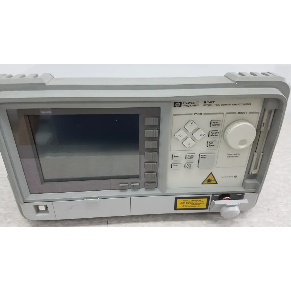 Gray plastic hewlett packard 8147 optical time domain reflectometer with digital display and control buttons with accessories and case