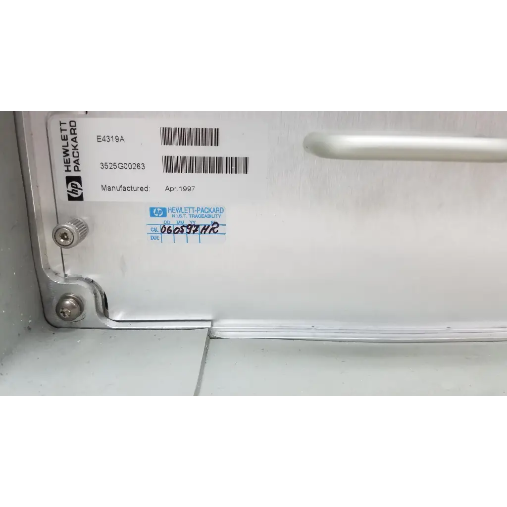 White hewlett packard 8147 optical time domain reflectometer case with silver screws and barcode label visible