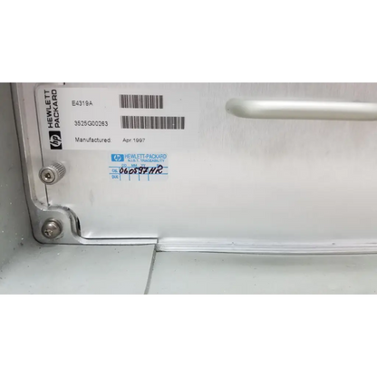 White hewlett packard 8147 optical time domain reflectometer case with silver screws and barcode label visible