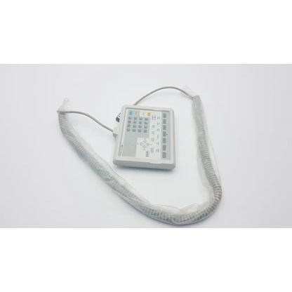 Gray hewlett packard m1106c patient monitor keyboard with multiple buttons and coiled cable for medical use